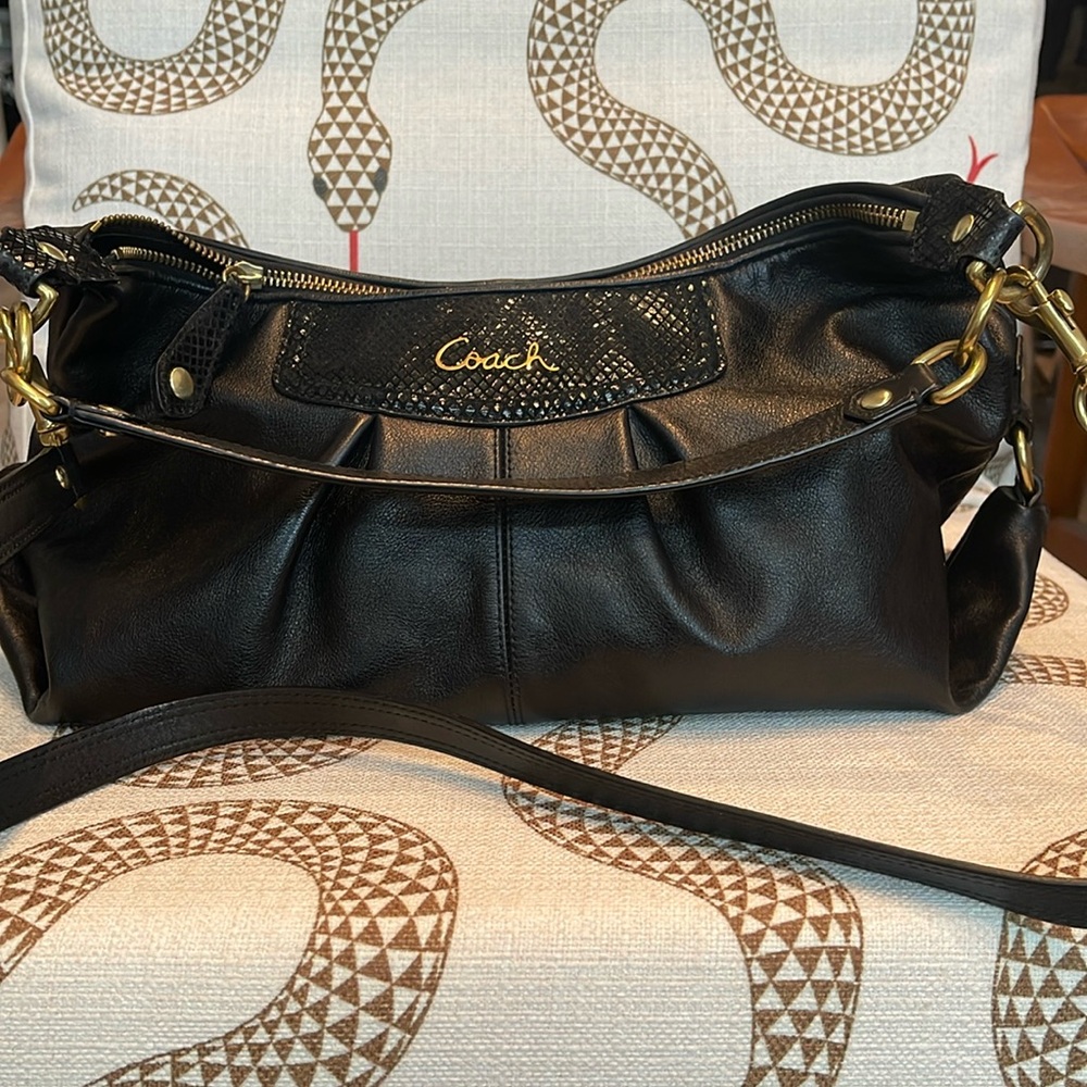Black Coach hobo-style handbag with gold hardware